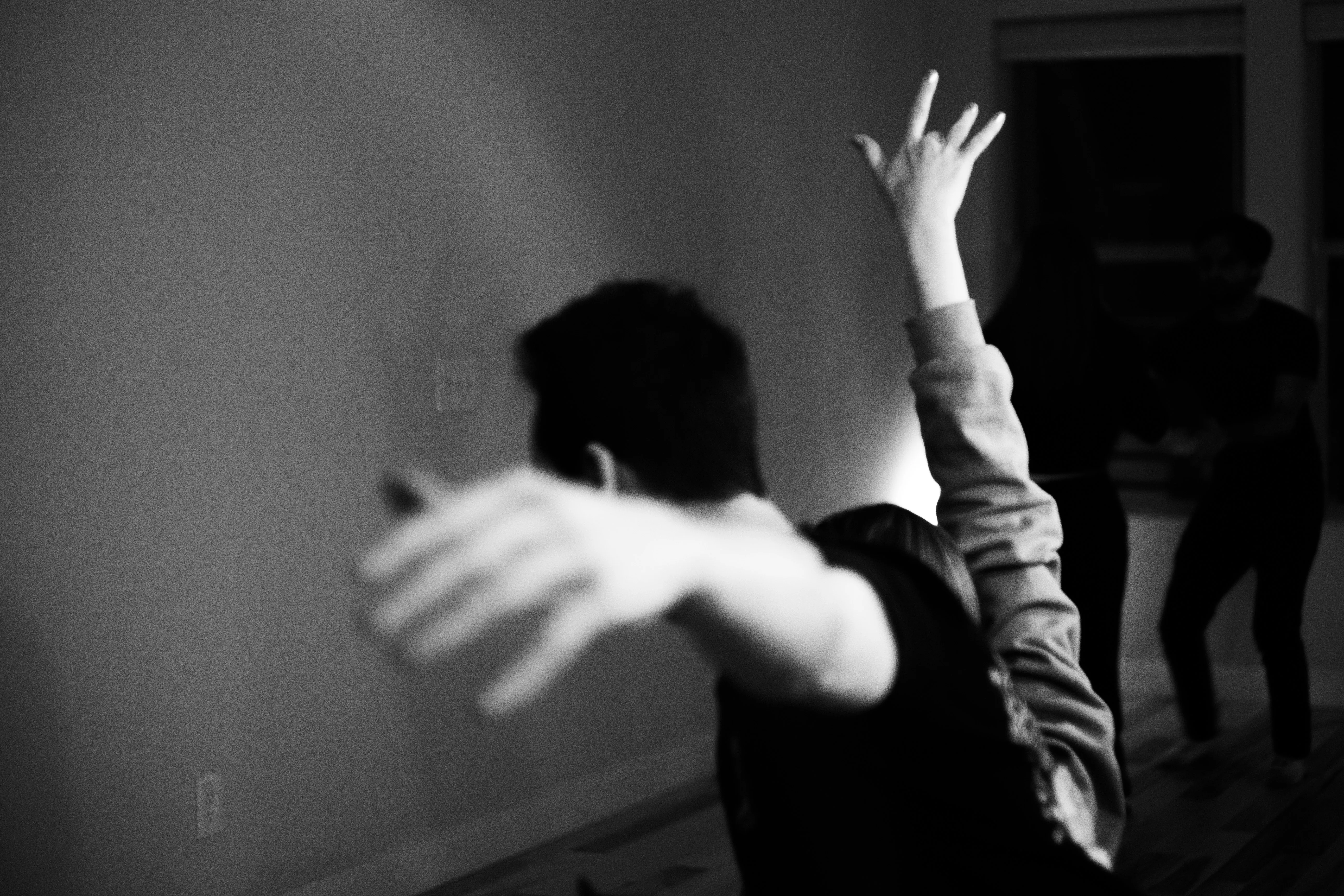 Two west coast swing dancers performing a dip.